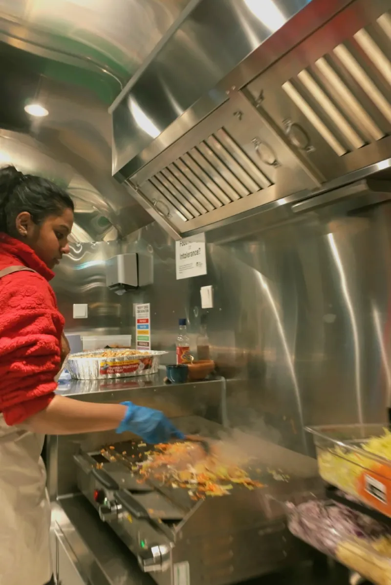 Interior view of The Lankan Fix food truck's clean, professional-grade stainless steel kitchen.