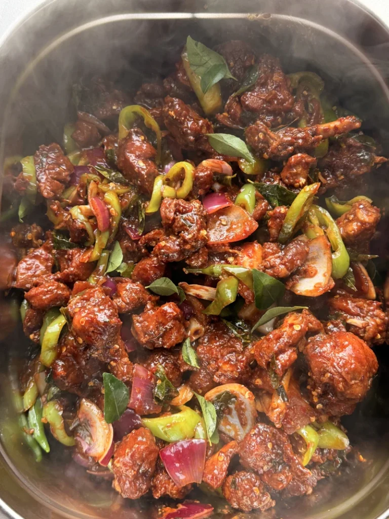 Spicy Sri Lankan devilled chicken with peppers and onions for event catering in Sheffield.