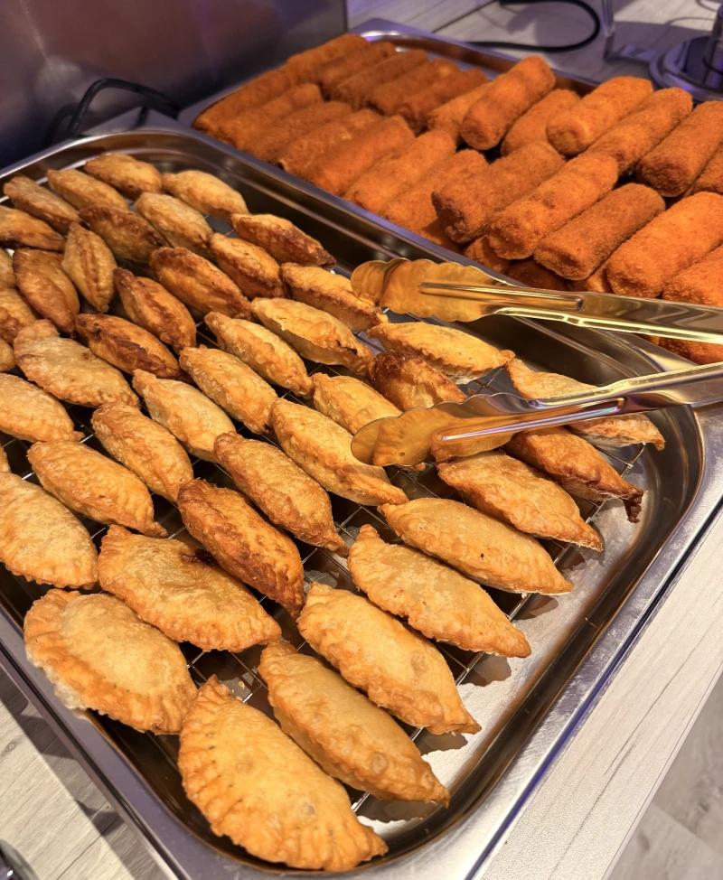 A selection of crispy Sri Lankan mutton rolls and vegetable patties for event catering.